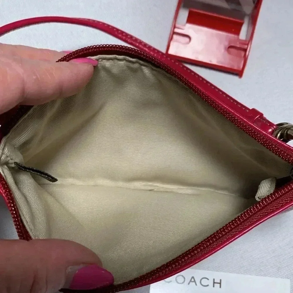 COACH Wristlet, patent leather. NWT.